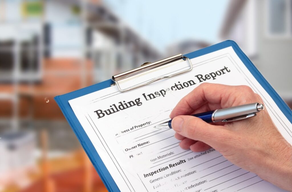 stock-photo-building-inspector-completing-an-inspection-form-on-clipboard-1017601234-transformed-min
