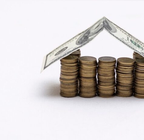stock-photo-house-made-with-coins-and-a-roof-of-dollar-bills-2020788665-transformed-min
