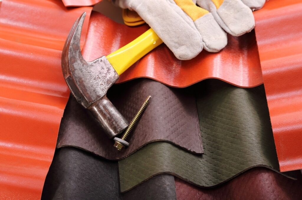stock-photo-the-roofs-of-various-solid-materials-a-hammer-and-a-screw-fixing-319005803-transformed-min