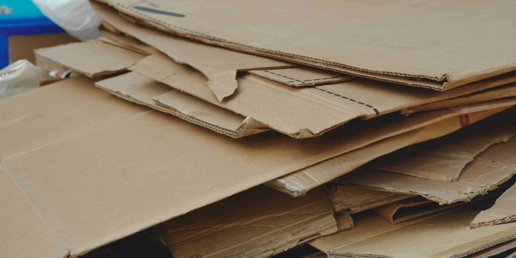 A stack of cardboard boxes arranged on a table, showcasing various sizes and shapes.